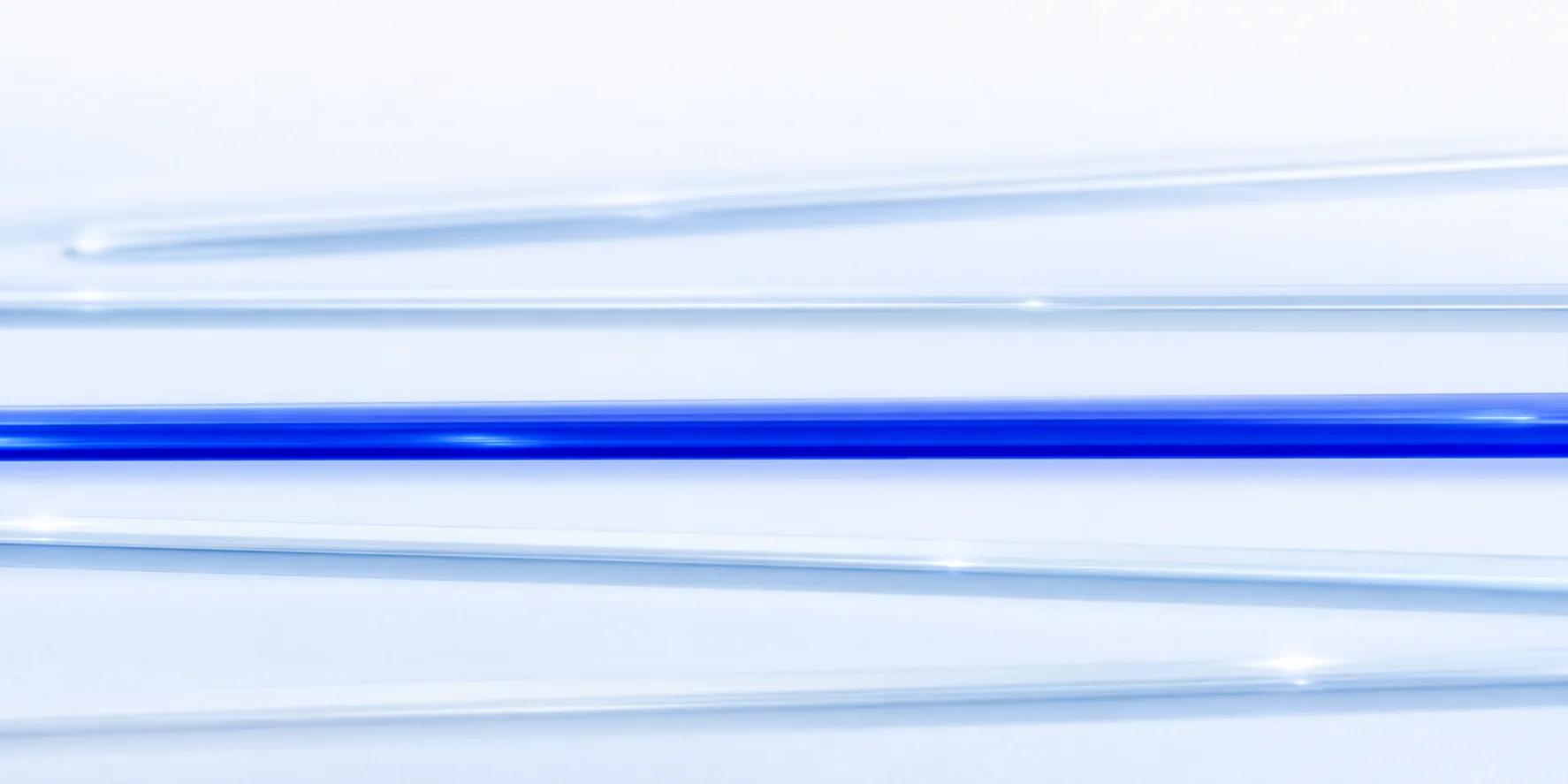 Abstract composition: separated lanes of light, one of them glowing blue, none bleeding into the others.
